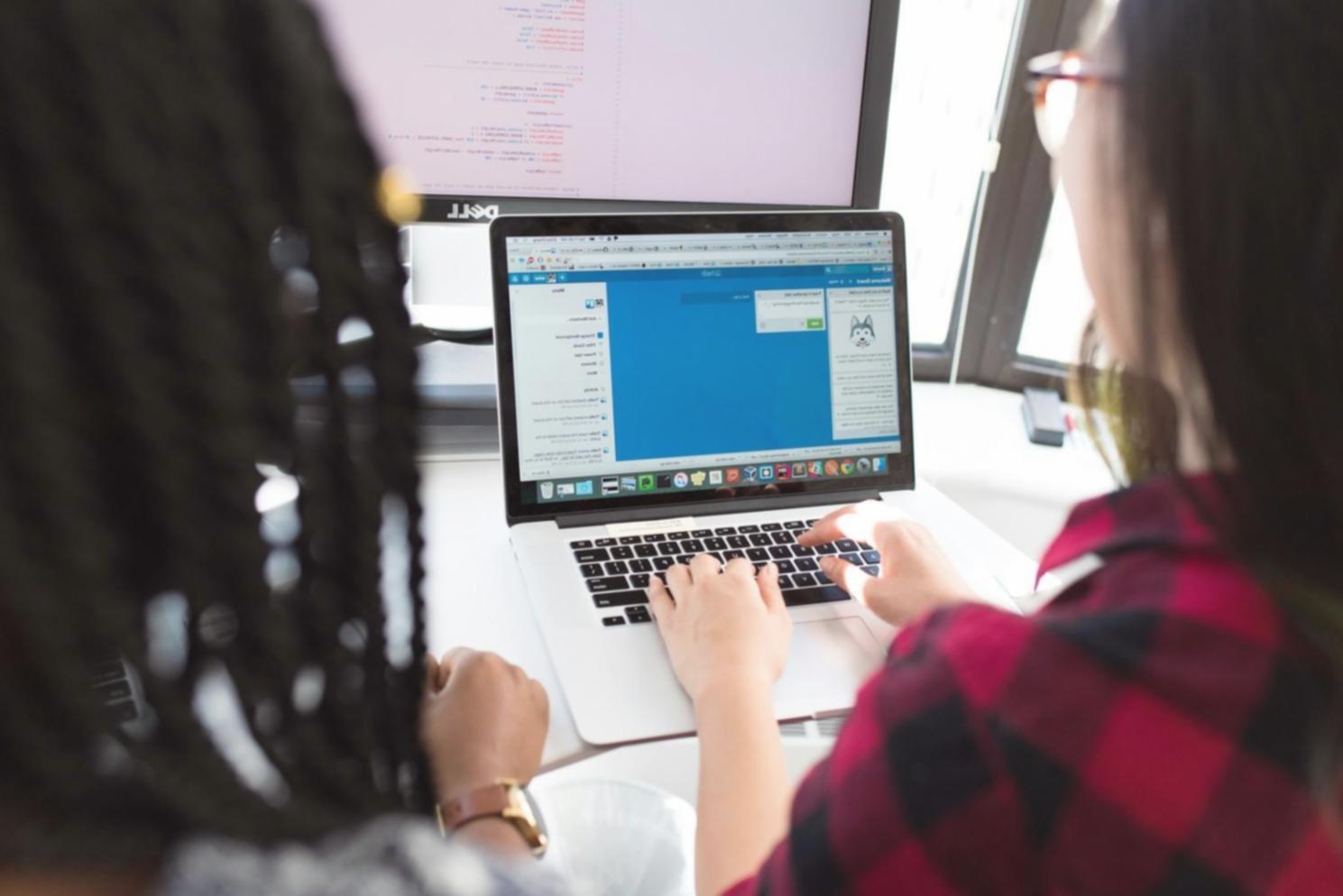 Team collaboration session reviewing custom bot functionality